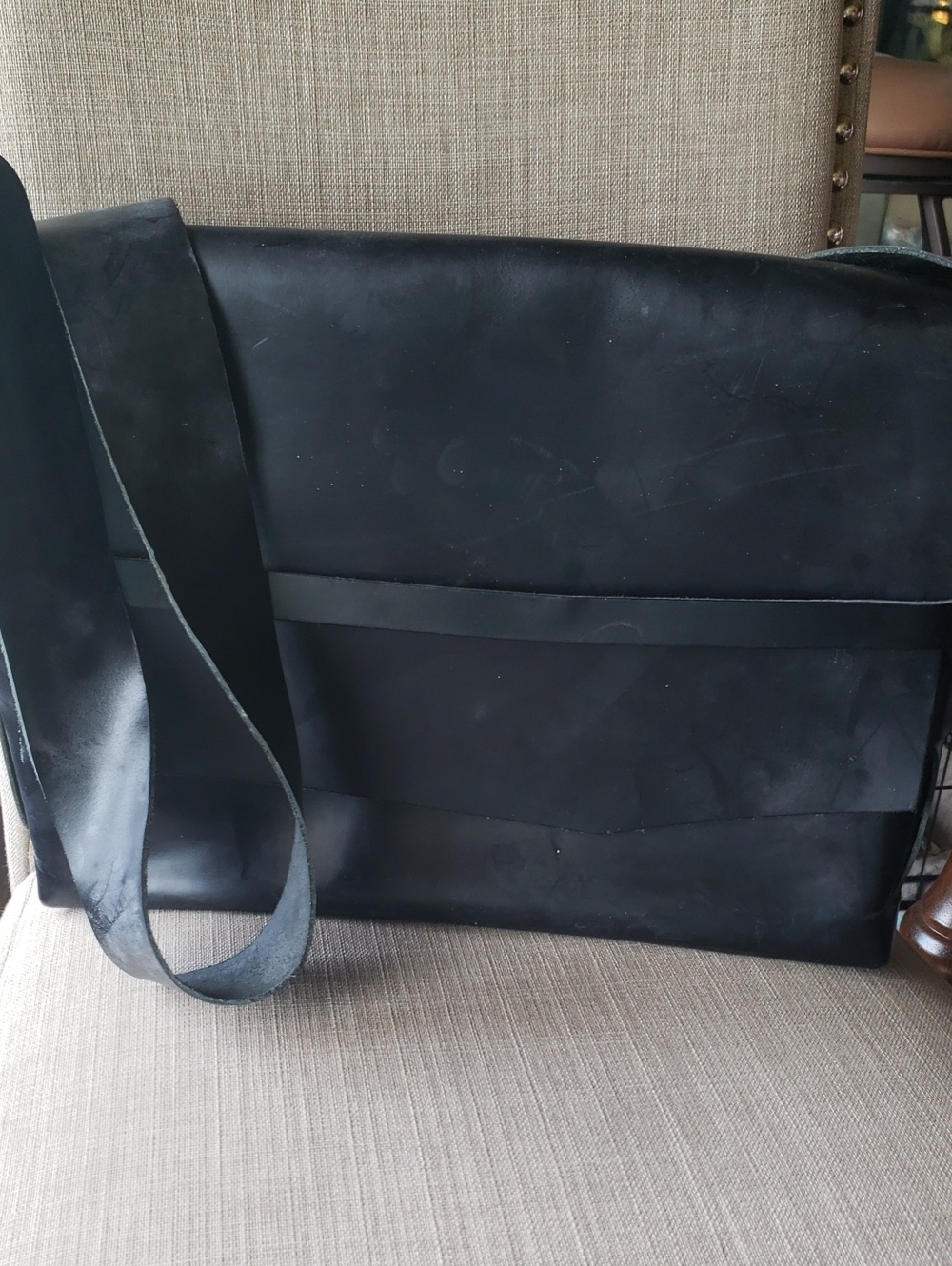 Minimalist Black Leather Messenger Bag with Wide Strap